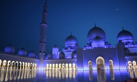 Sheikh Zayed Grand Mosque illuminated at night during Islamic New Year celebrations